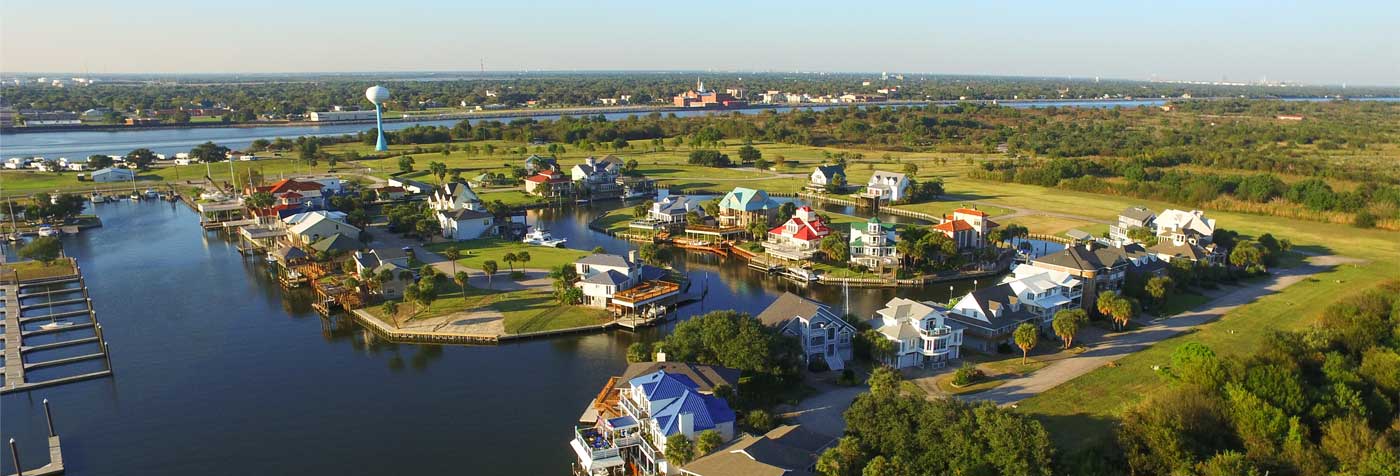 aerial view of homes on the water in port arthur texas